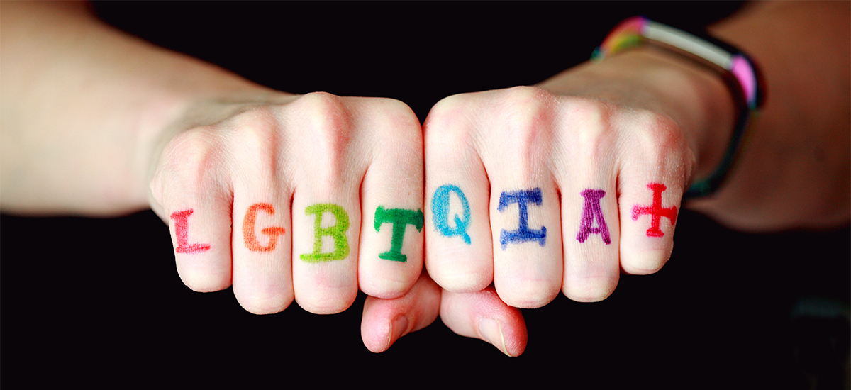 LGBTQIA+ knuckle tats